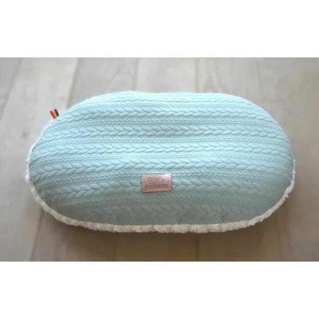 Coussin oval.