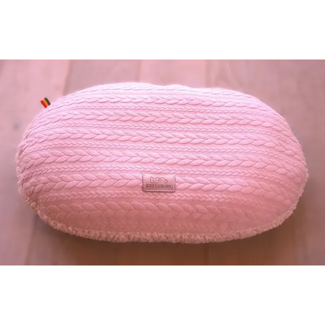 Coussin oval.